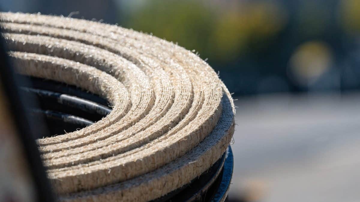 Close-up of cured-in-place pipe liner material coiled on a reel